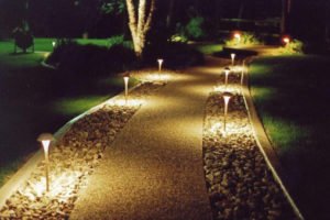 Lights illuminating a pathway at night
